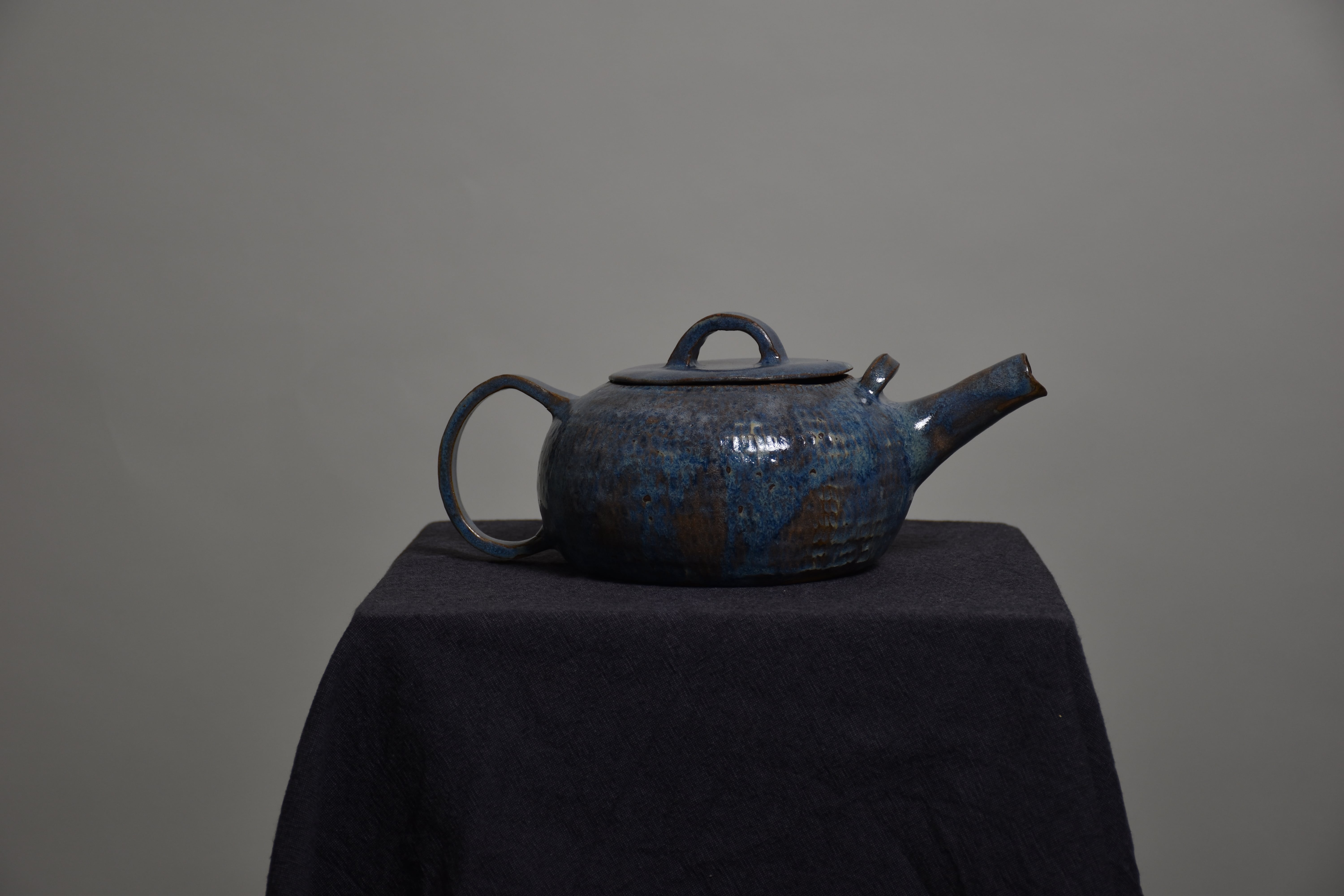 a ceramic, blue coffe pot